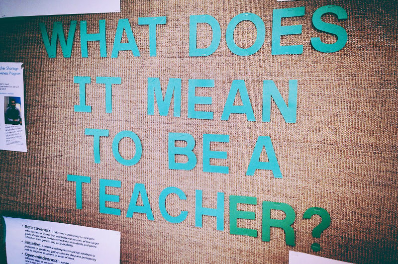 What does it mean to be a teacher writing in a board.