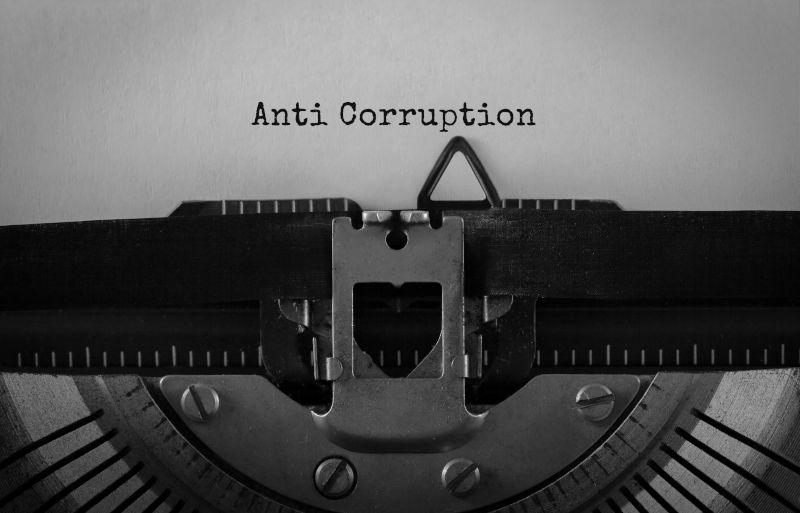 Text Anti Corruption typed on retro typewriter