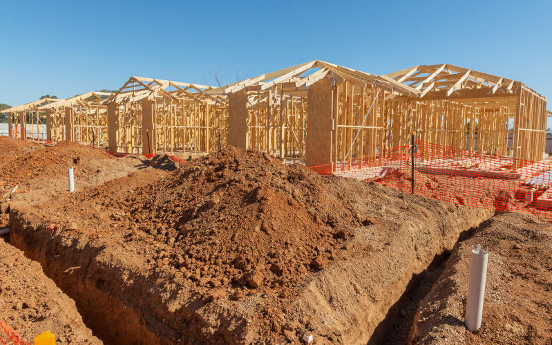 New suburban homes currently under construction in row