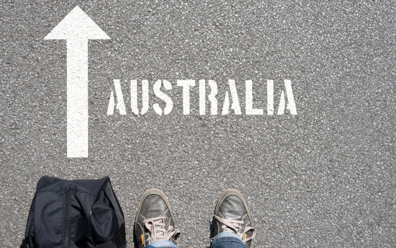 A man with a travel bag on his way to Australia.