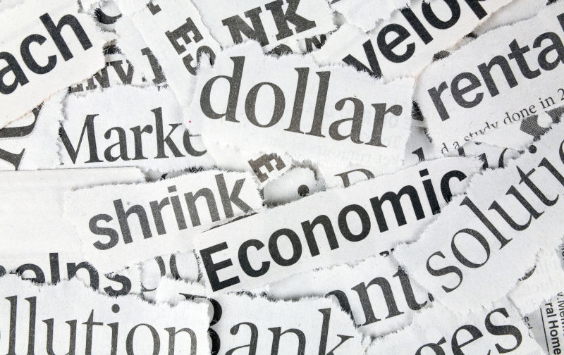 Newspaper Headlines close up for background economy.