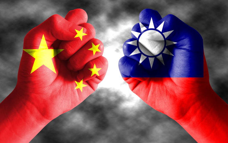 Taiwan flag and Chinese flag on fists.