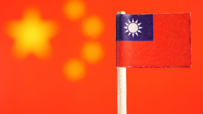 Taiwanese flag with Chinese Flag in background.