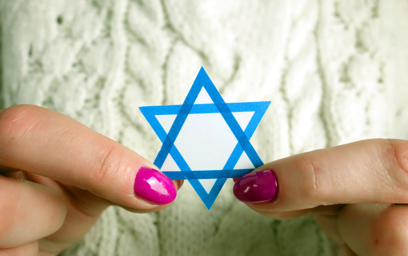 Woman holding David Star. Israel, Judaism, Holocaust, Zionism concept.