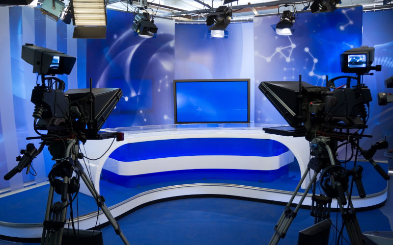 TV news studio with camera and lights