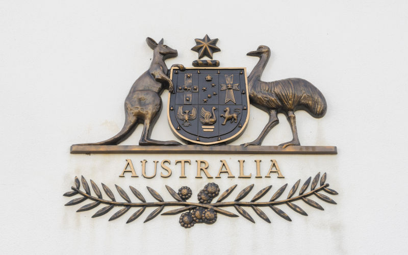 Canberra, Australia - June 28, 2016: View of The Commonwealth Coat of Arms, the formal symbol of the Commonwealth of Australia, in bronze outside the old Parliament House.