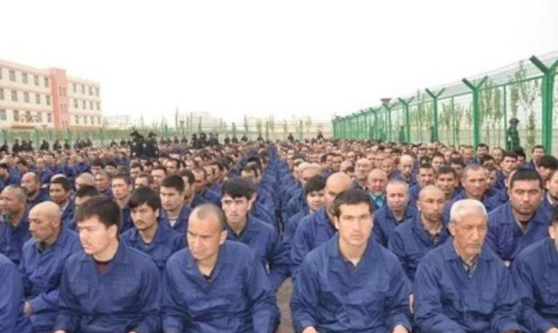 Detainee in a Xinjiang Re-education Camp located in Lop County listening to 