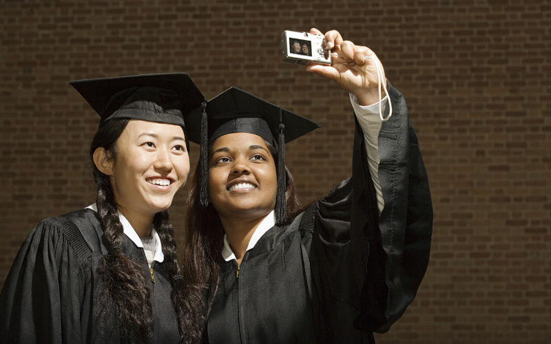 International graduates taking a photograph. Image: iStock