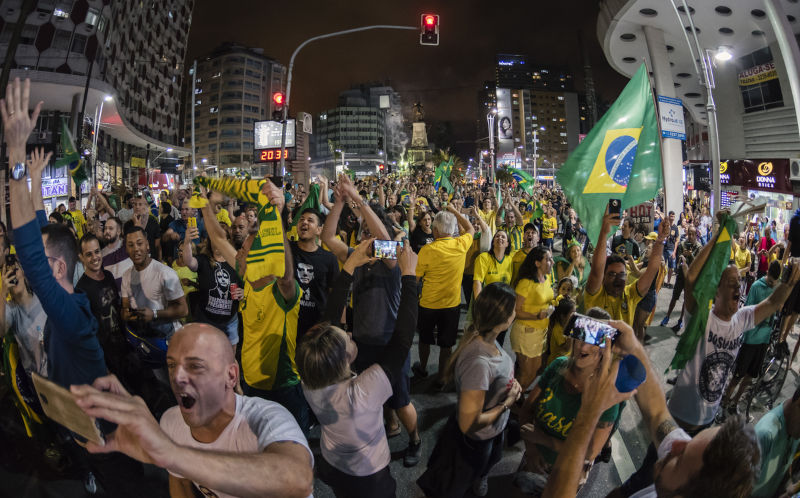 Santos, Brazil: People celebrating the victory of Jair Bolsonaro in the elections for president of Brazil in Independence Square in the city of Santos.