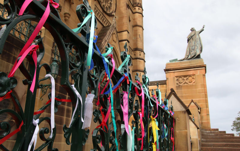 Sydney, Australia. 31st January 2023. Ribbons tied by abuse survivors to fence of St Mary?s Cathedral ahead of Cardinal Pell?s funeral on Thursday, 2nd February 2023. Credit: Richard Milnes/Alamy live News