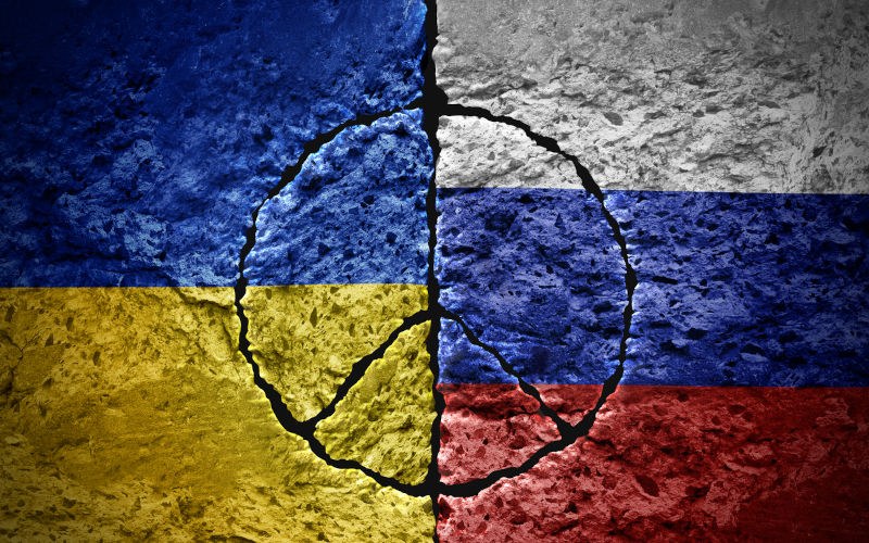 Russia and Ukraine War and peace summit symbol as cracks in cement for the Ukrainian and Russian nations.