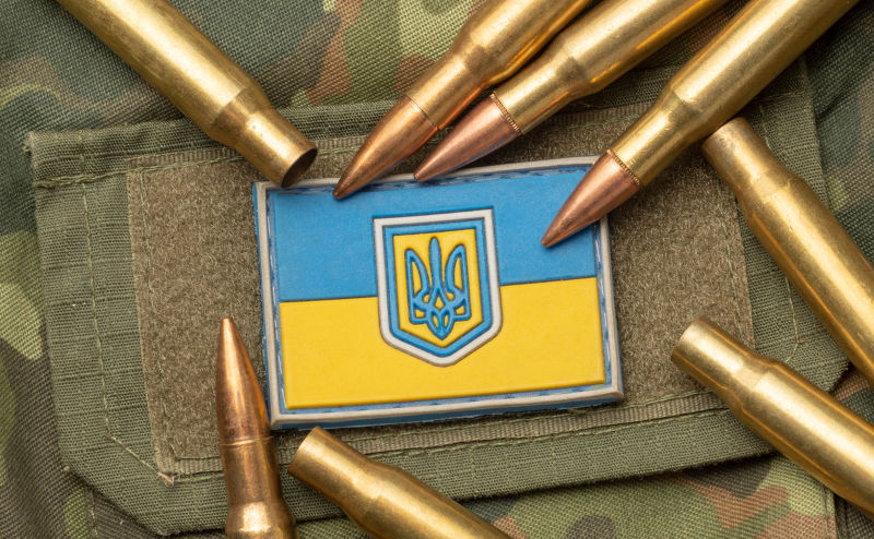Combat-bullets-on-the-background-of-the-Ukrainian-flag. Image: iStock combat bullets on the background of the Ukrainian flag.