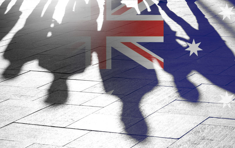 Australian Flag as Background and Silhouettes of People - conceptual Picture about Independence Vote Patriotism political situation and Migrants.