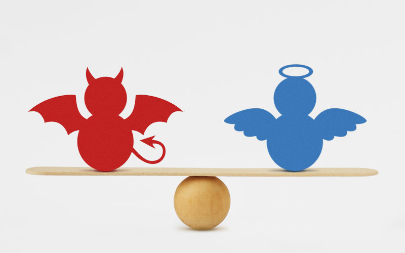 Devil and angel on balance scale.