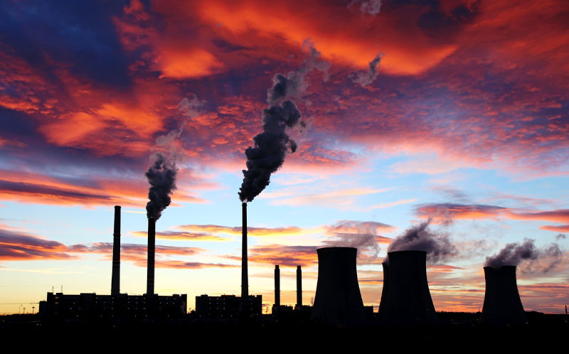 Dramatic sunset on the sky and coal power plant