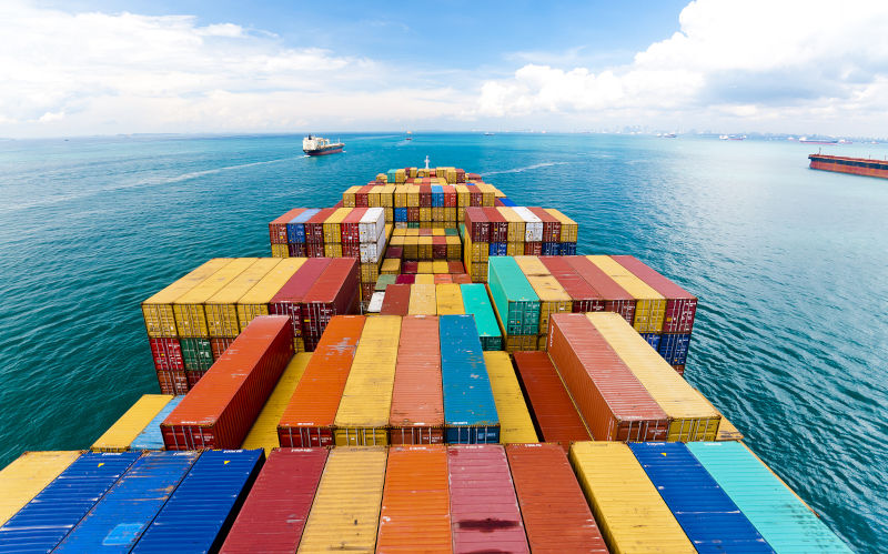 View of heavy loaded container cargo ship.