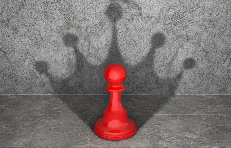 Pawn-cast-shadow-in-form-of-silhouette-crown. Image: iStock Pawn cast shadow in form of silhouette crown.