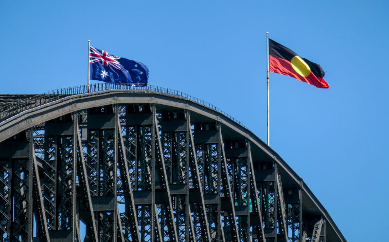 The Australian flag and Australian Aboriginal flag fly on the Sydney.