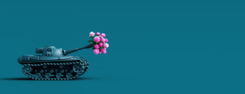 Toy tank fires a bouquet of flowers. Peace concept background