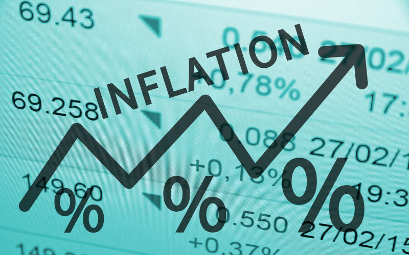 Word Inflation on up trend arrow, with financial data visible on the background.