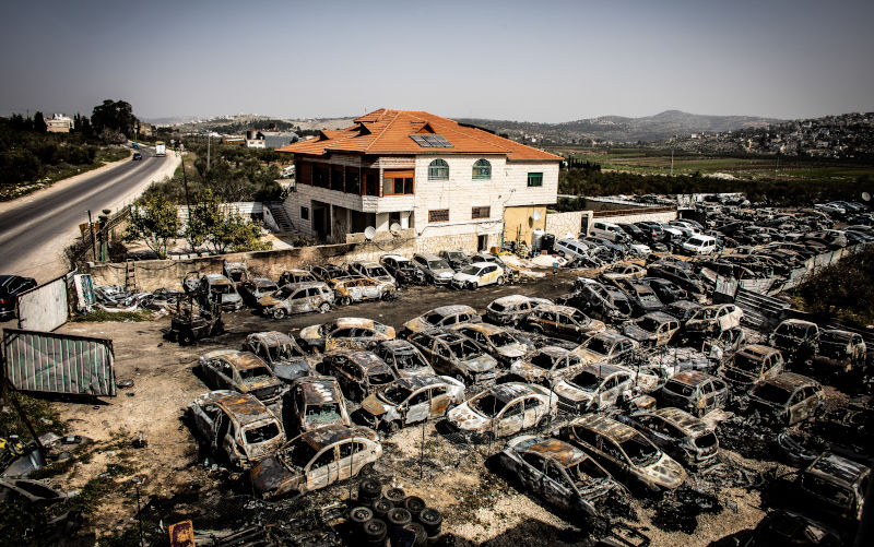 Torched cars in the occupied West Bank town of Huwara Tuesday, Feb 28, 2023. US State Department spokesman Ned Price says the Biden administration expects Israel to prosecute those responsible for Sundays deadly settler rampage of Huwara and provide compensation for the Palestinians whose homes and property were destroyed or damaged. Image: AAP Photo by Eyal Warshavsky / SOPA Images/Sipa USA)