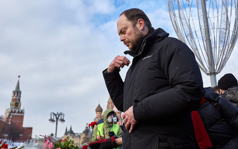 Vladimir Kara-Murza makes the sign of the cross at the place of Boris Nemtsov's death in Moscow.