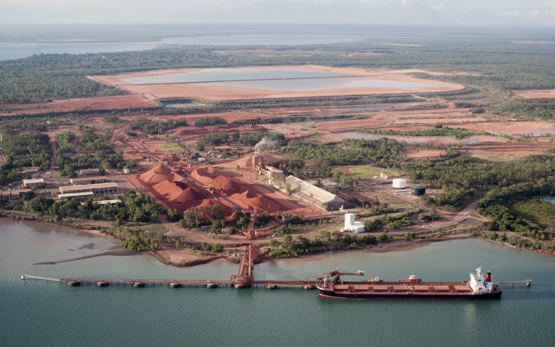 Ore ship loading bauxite at the mining port of Weipa, Queensland,Australia.