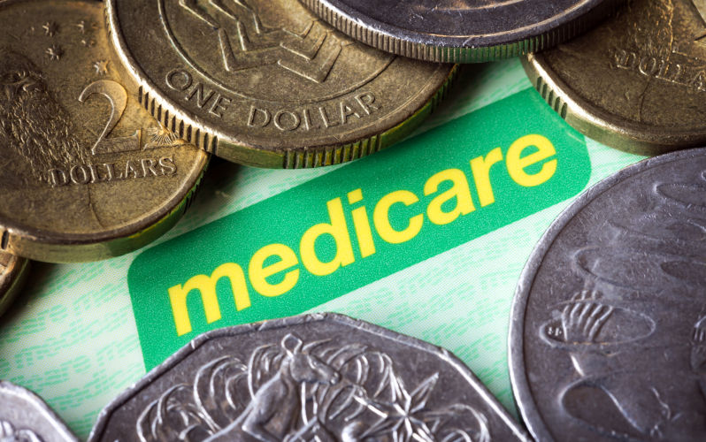 Australian Medicare card and money.