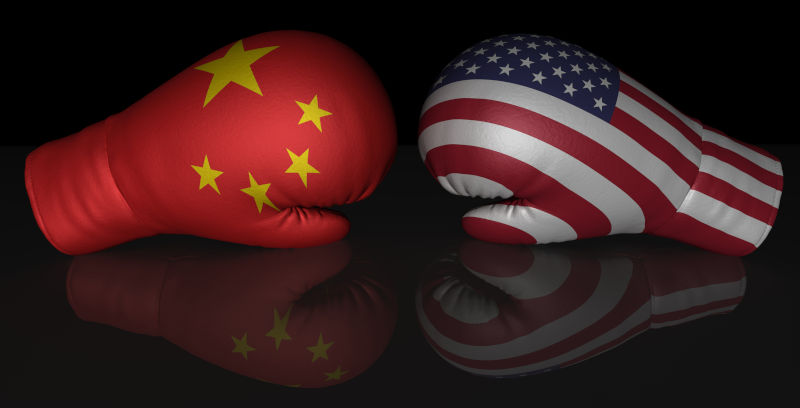 China USA flags boxing gloves isolated on black background.