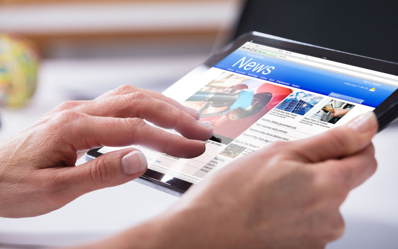 Close-up Of A Person's Hand Using Digital Tablet