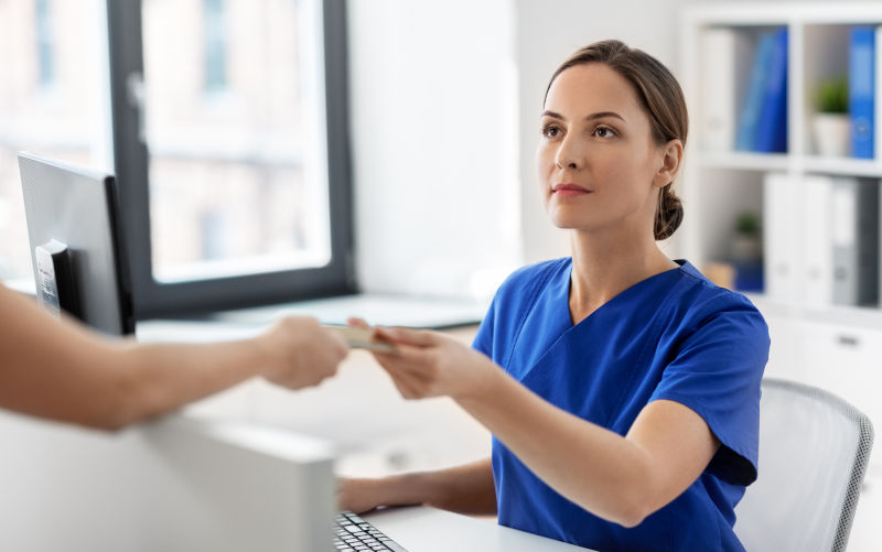 Female doctor or nurse and patient.