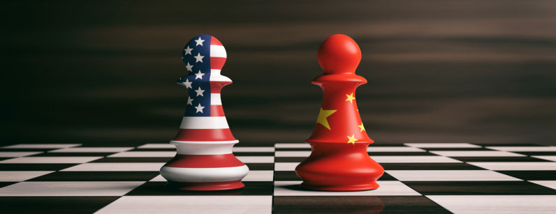 US America and China flags on chess pawns soldiers on a chessboard.