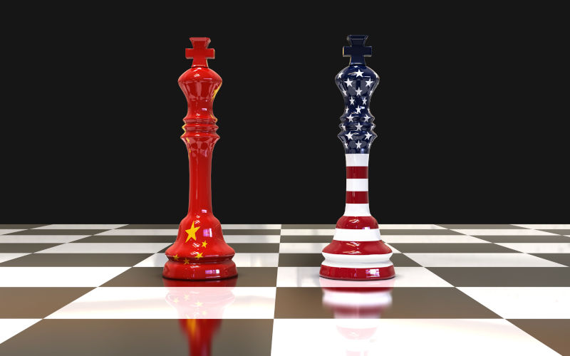 Two chess king on chess board US and China flag.