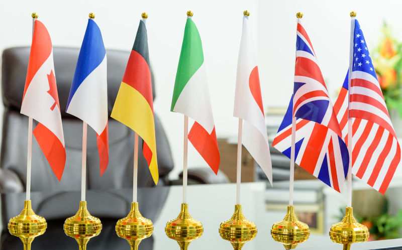 World economy and economic policies concept : Flags of G7 or group of seven countries e.g Canada, France, Germany, Italy, Japan, UK, USA.