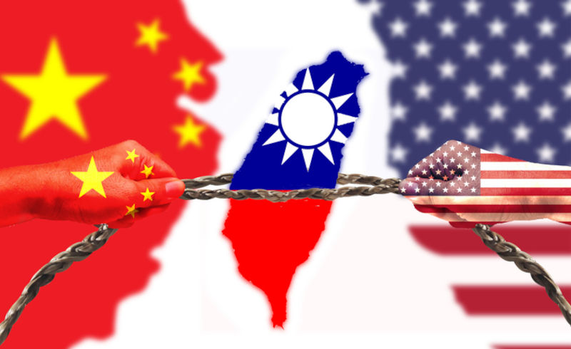 United States and China flags combined fist together. Taiwan flag in tug of war.