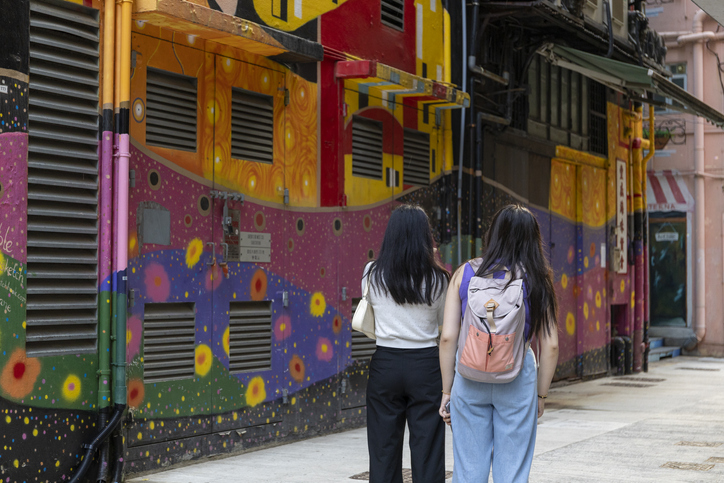 2023 Mar 17, Hong Kong. People Look at Beautiful mural in Sai Ying Pun, Hong Kong Image:iStock/Derek Yung