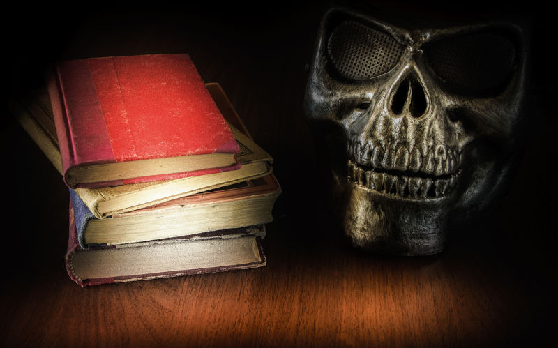 Skull with books.