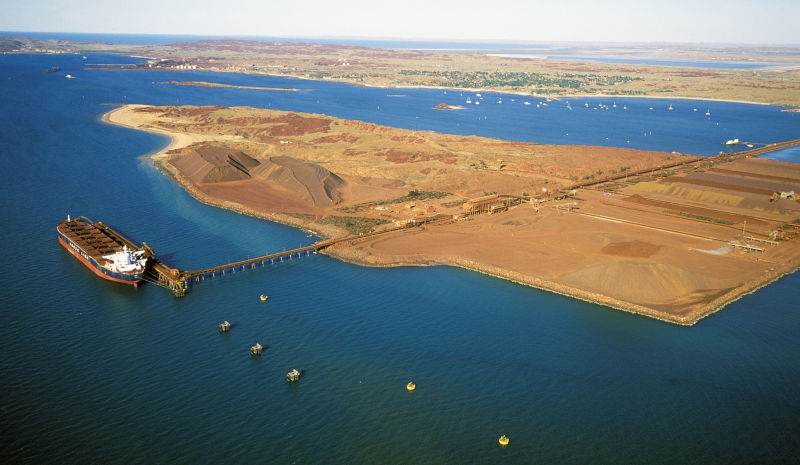 Loading iron ore on to bulk tanker at Dampier on the Western Australian coast.