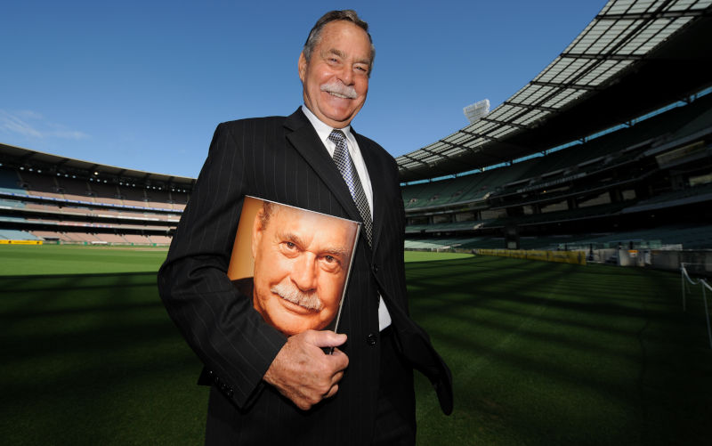 Australian Rules Football legend Ron Barassi poses for a photo with a copy of his new book Icons Of Australian Sport at the MCG in Melbourne, Wednesday, Feb. 27, 2008. Ron Barassi, the first player to be inaugurated into the Australian Football Hall of Fame as a Legend, has died aged 87. Image: AAP/Julian Smith