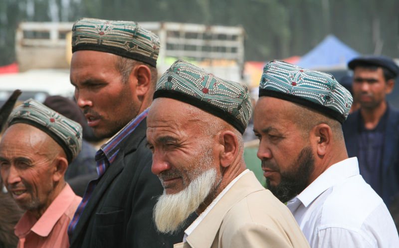 Uyghur farmers at the Kashgar Sunday Livestock Market, China