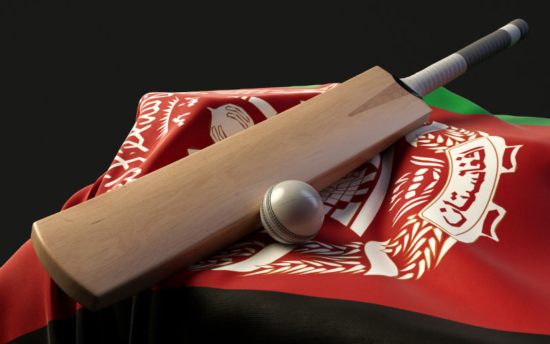 A plinth with a cricket ball and bat resting on a Afghanistan draped flag - 3D render